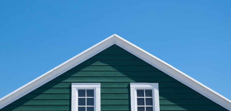 Green house and white roof with blue sky in sunny day